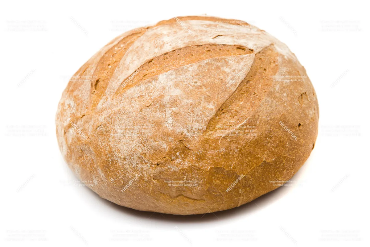 A close-up of artisan bread on a wooden surface, emphasizing the crust’s texture and the homely, hands-on feel of baking. The cozy ambiance suggests a space made for enjoying fresh, homemade meals with loved ones.